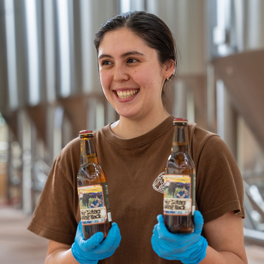 Brewer Savannah Baird with Four Sisters Spring Bock bottles