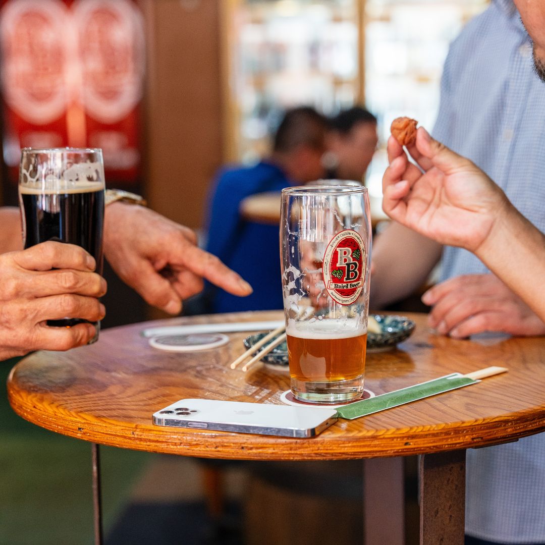 pint of beer on table at Baird Base Station Kansai